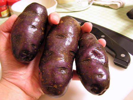 Purple fingerling potatoes, scrubbed clean.