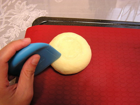 Yes, this is a 29-cent pan scraper that I'm using instead of an actual dough scraper.